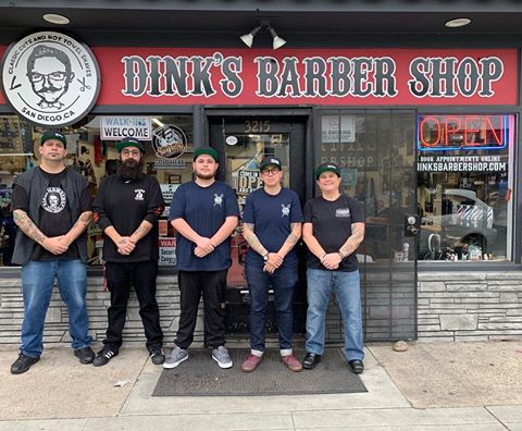 The team at Dink's Barber Shop & Supply standing in front of their Adams Avenue location in San Diego, ready to provide expert barber services.