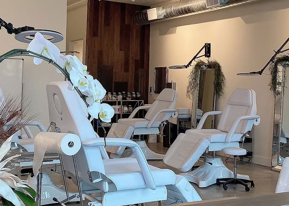 Luxury brow studio at Advanced Brow Design in San Diego, featuring modern white treatment chairs, professional lighting, and a serene atmosphere.