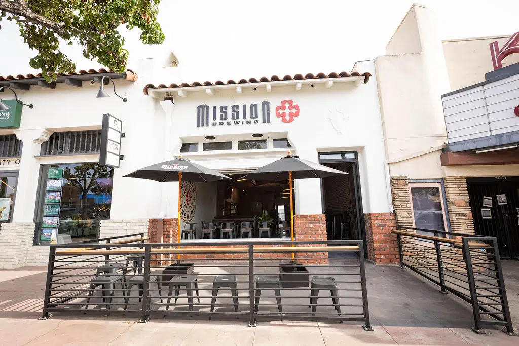 Interior of Mission Brewing Kensington featuring a spacious seating area with patrons enjoying craft beverages.