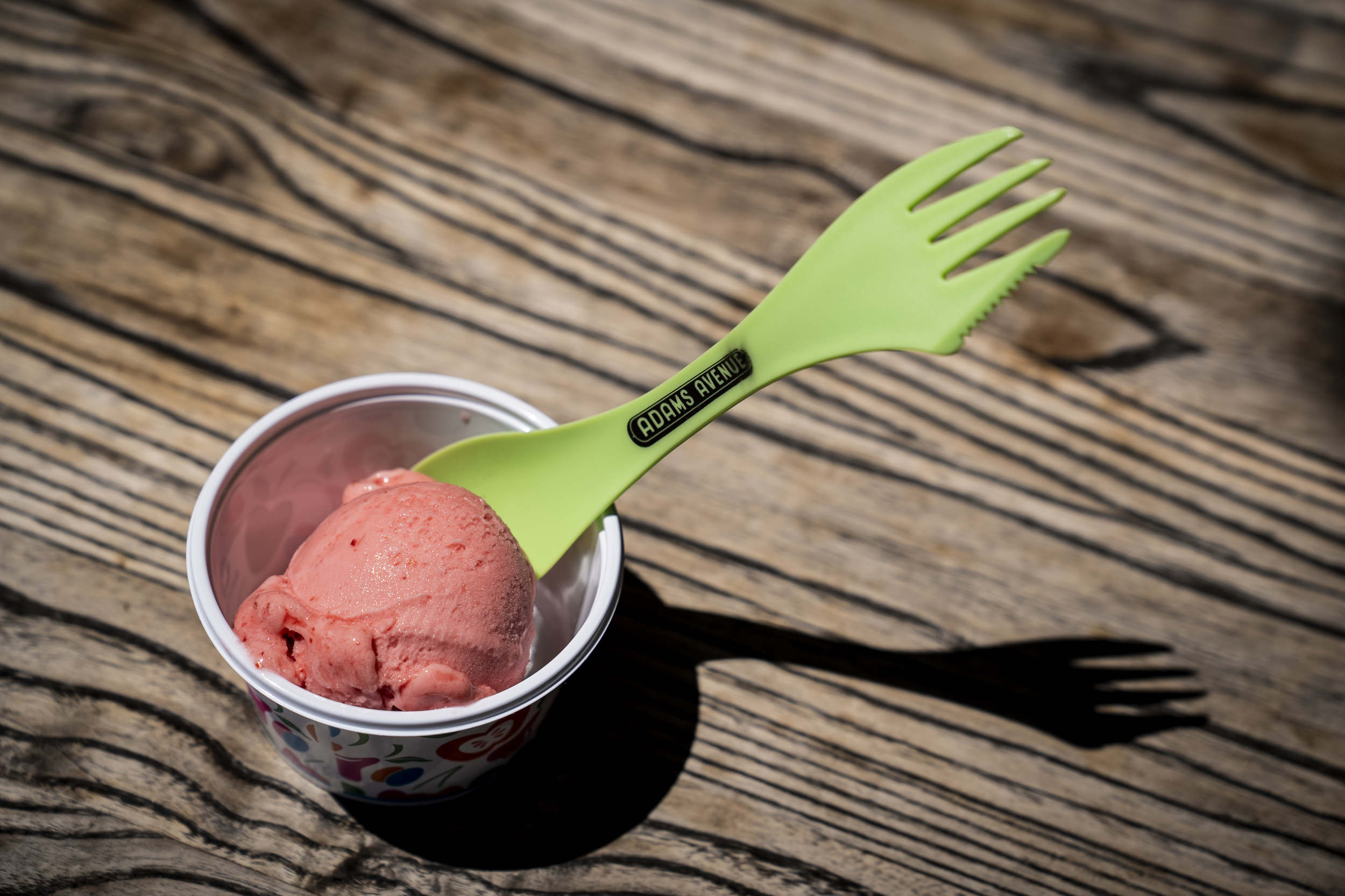 A Taste of Adams Avenue fork and spoon rests inside a gelato cup at Papalecco