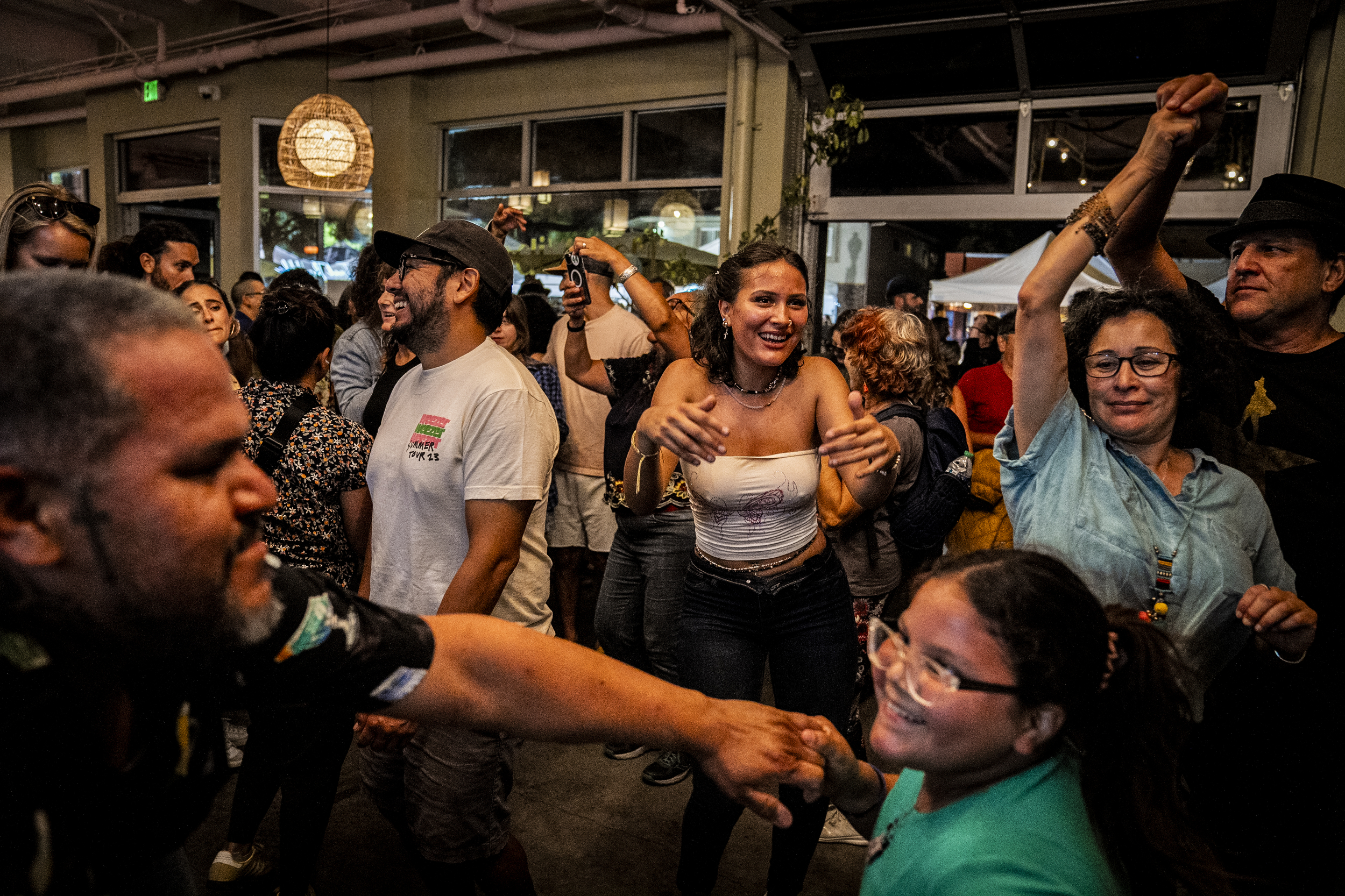 People dance during the Adams Avenue Street Fair