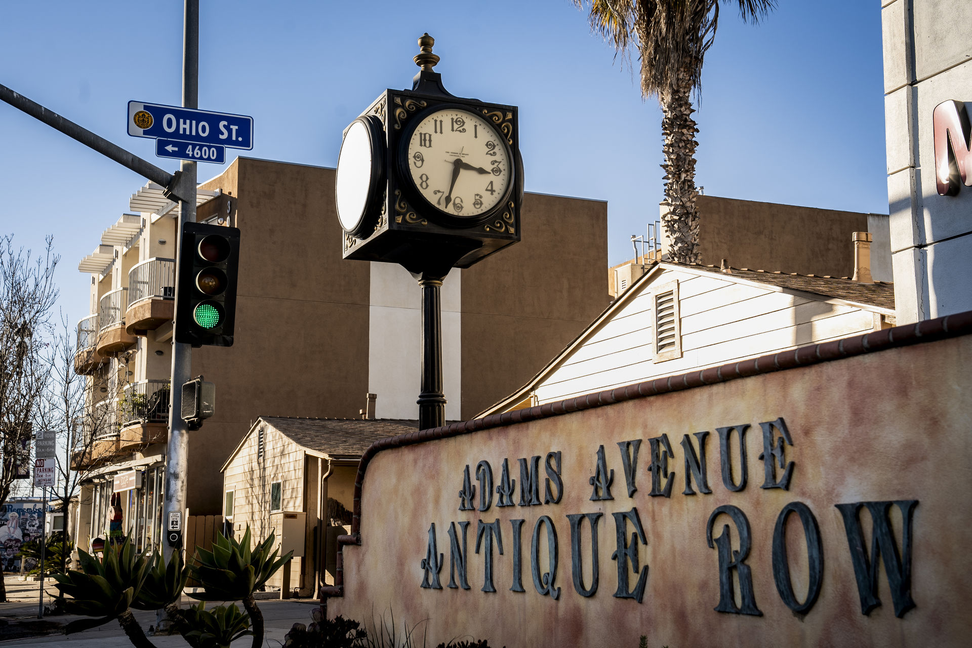 A view of the Adams Avenue Antique Row sign and clock
