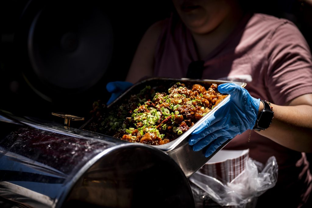 Fortunate Son serves up special tasting items to participants in the 2025 Taste of Adams Avenue  on Sunday, June 29, 2025 in San Diego, California. (Sam Hodgson / Uptown 11 Studios)