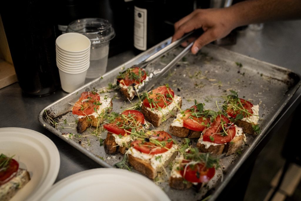 bica serves up tartines to participants in the 2025 Taste of Adams Avenue  on Sunday, June 29, 2025 in San Diego, California. (Sam Hodgson / Uptown 11 Studios)