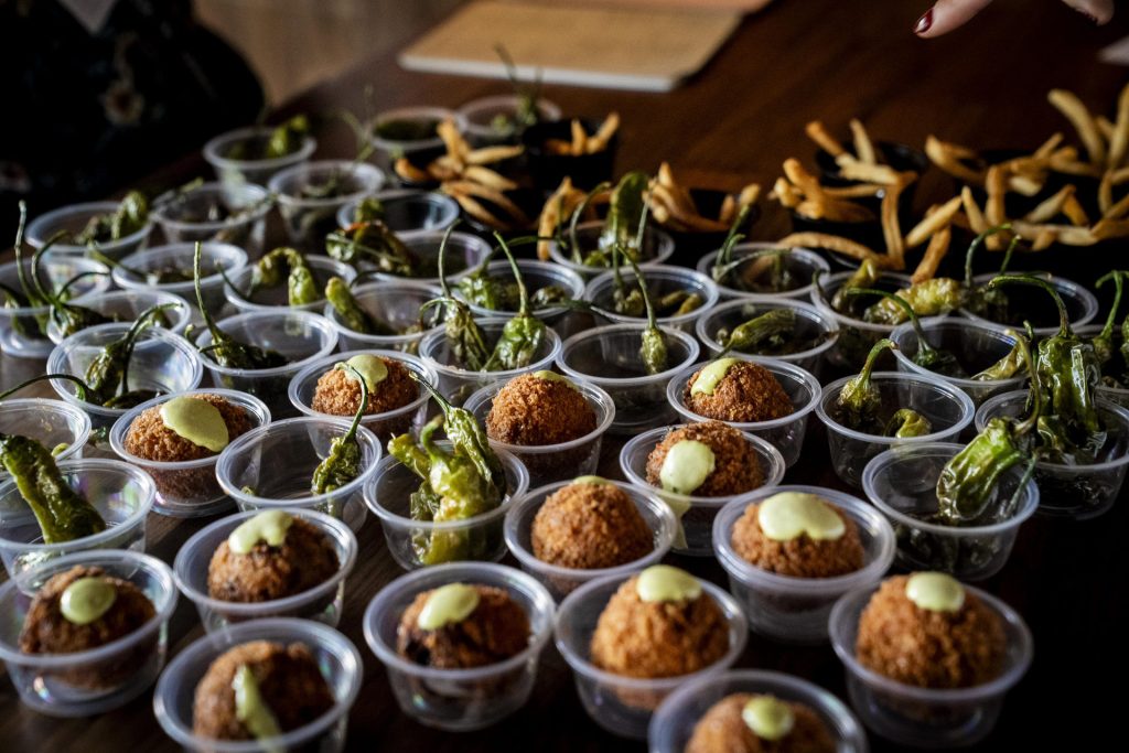Nómade serves up special tasting items to participants in the 2025 Taste of Adams Avenue  on Sunday, June 29, 2025 in San Diego, California. (Sam Hodgson / Uptown 11 Studios)