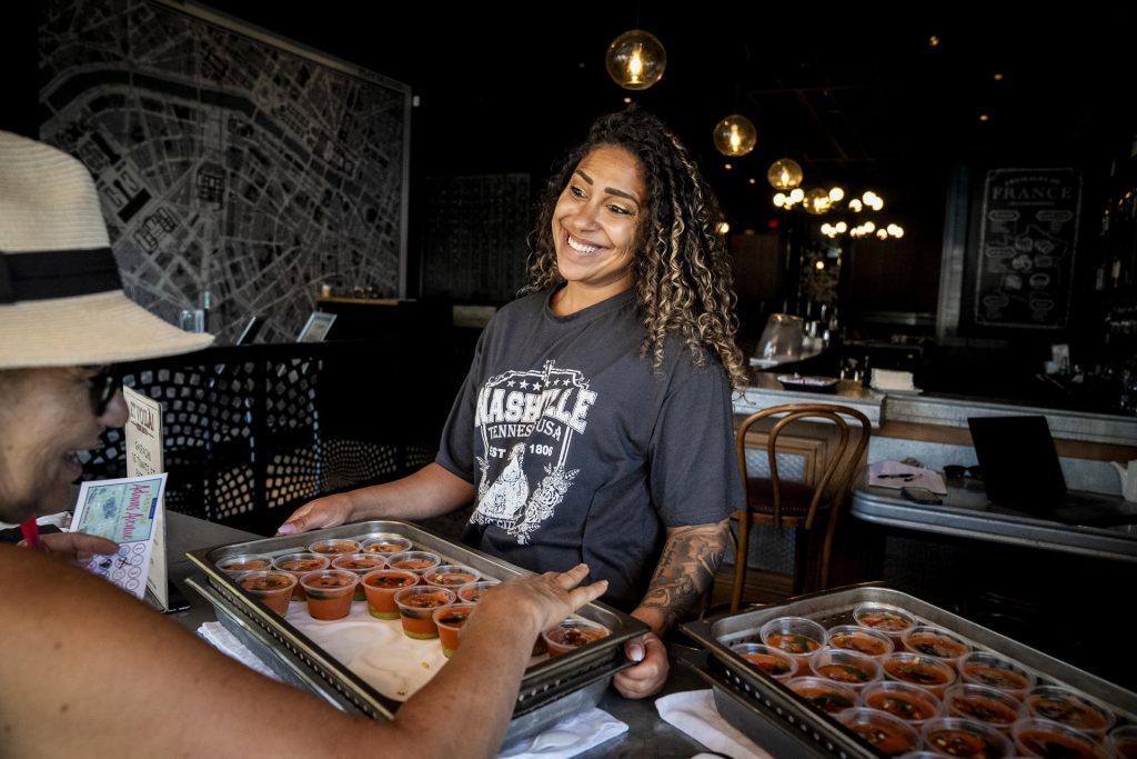Et Voilà! French Bistro serves up gespacho to participants in the 2025 Taste of Adams Avenue  on Sunday, June 29, 2025 in San Diego, California. (Sam Hodgson / Uptown 11 Studios)