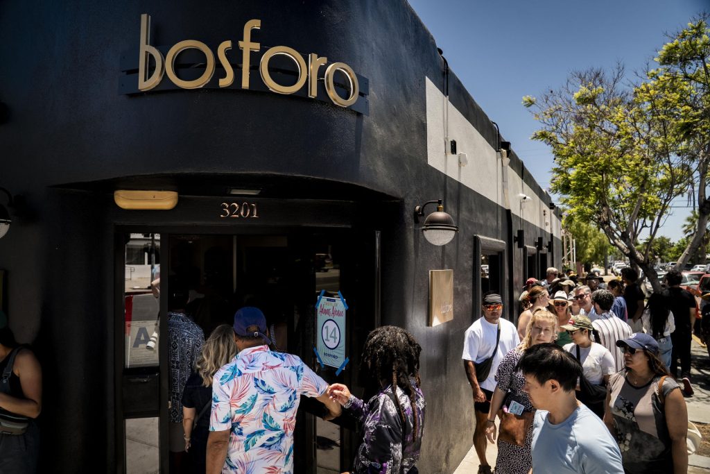 Bosforo serves up slices of pizza to participants in the 2025 Taste of Adams Avenue on Sunday, June 29, 2025 in San Diego, California. (Sam Hodgson / Uptown 11 Studios)